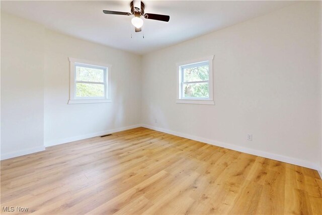 209 Beechwood Blvd, Wintersville, OH 43953 - spare room featuring healthy amount of natural light, wood finished floors, and a ceiling fan