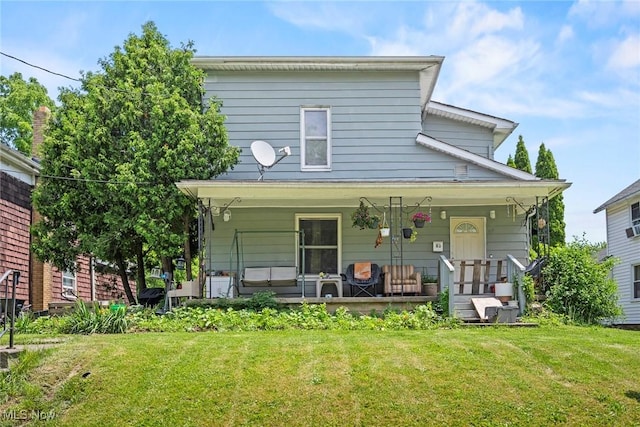 83 S Pleasant St, Oberlin, OH 44074 - view of front of home with covered porch and a front lawn