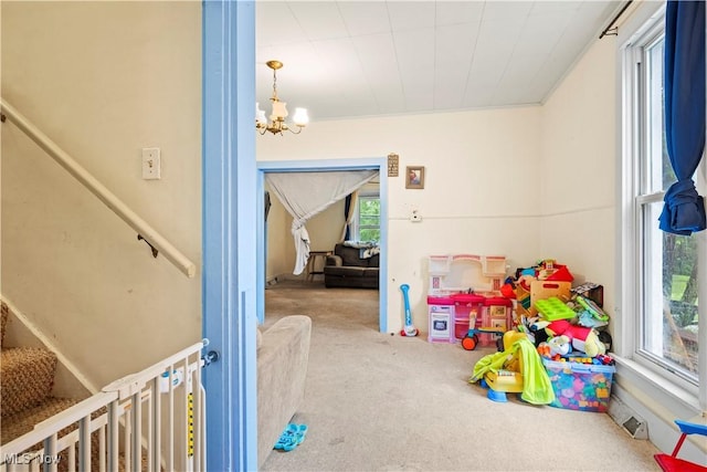 83 S Pleasant St, Oberlin, OH 44074 - recreation room with carpet flooring and a chandelier