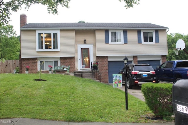 2869 Wexford Blvd, Stow, OH 44224 - raised ranch with a garage, brick siding, a chimney, and concrete driveway