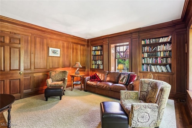2820 W Park Blvd, Shaker Heights, OH 44120 - living area featuring wood walls, ornamental molding, carpet floors, and built in shelves