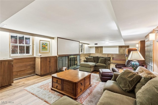 2820 W Park Blvd, Shaker Heights, OH 44120 - living area featuring light wood-style floors, wainscoting, a fireplace, and wood walls