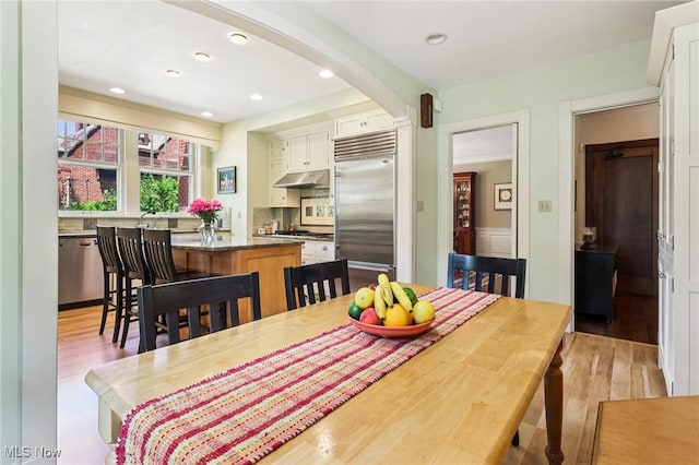 2820 W Park Blvd, Shaker Heights, OH 44120 - dining area featuring arched walkways, light wood-style flooring, and recessed lighting