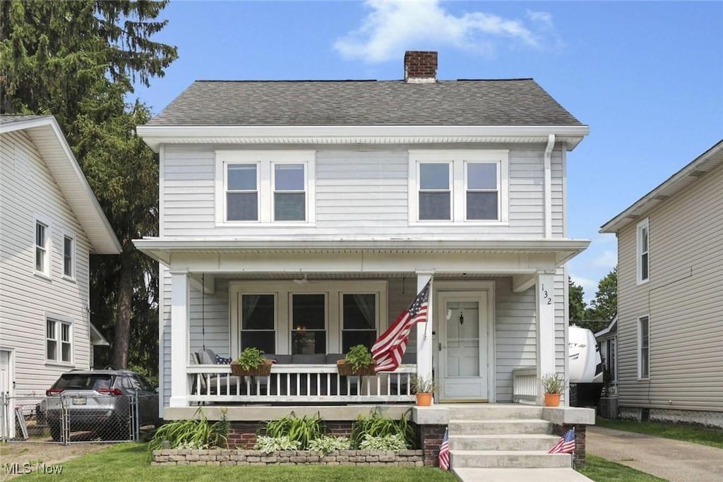 132 Neal Ave, Newark, OH 43055 - view of front of house with covered porch, a chimney, and roof with shingles