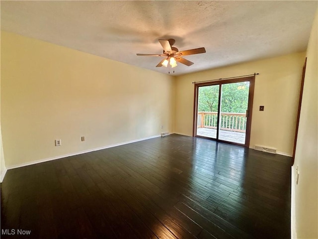 29123 Ridge Rd, Wickliffe, OH 44092 - unfurnished room with ceiling fan, dark wood-type flooring, and a textured ceiling