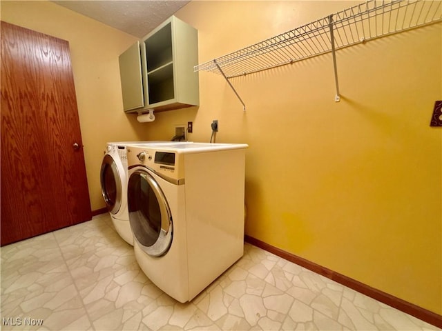 29123 Ridge Rd, Wickliffe, OH 44092 - laundry area with independent washer and dryer and baseboards