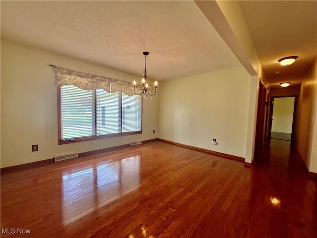 29123 Ridge Rd, Wickliffe, OH 44092 - unfurnished dining area featuring wood finished floors and a chandelier