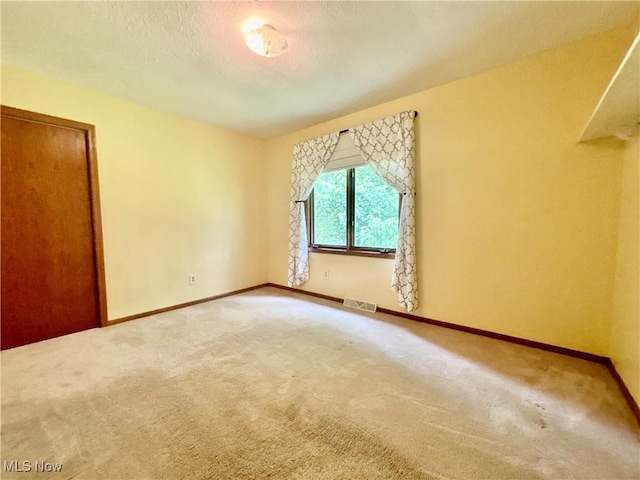 29123 Ridge Rd, Wickliffe, OH 44092 - carpeted empty room featuring baseboards and a textured ceiling