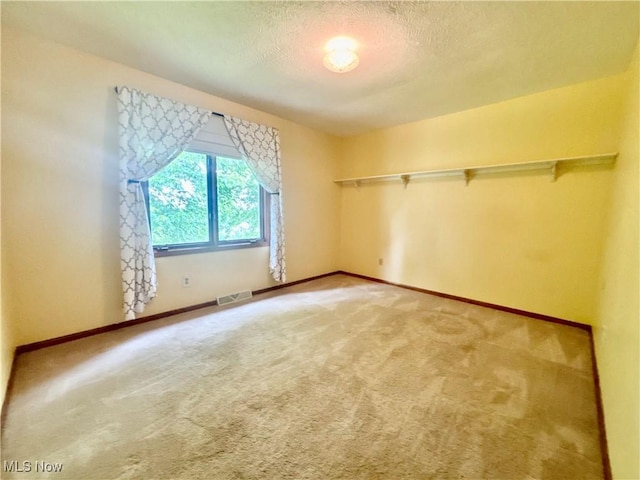 29123 Ridge Rd, Wickliffe, OH 44092 - spare room featuring light carpet and a textured ceiling