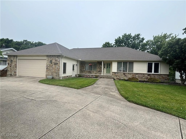 29123 Ridge Rd, Wickliffe, OH 44092 - single story home featuring stone siding, driveway, an attached garage, and a front yard
