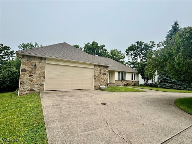 29123 Ridge Rd, Wickliffe, OH 44092 - single story home featuring stone siding, concrete driveway, a garage, and a front lawn