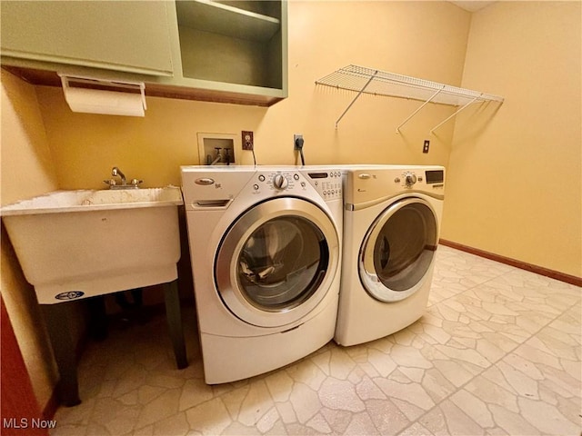 29123 Ridge Rd, Wickliffe, OH 44092 - laundry area featuring washing machine and clothes dryer and baseboards