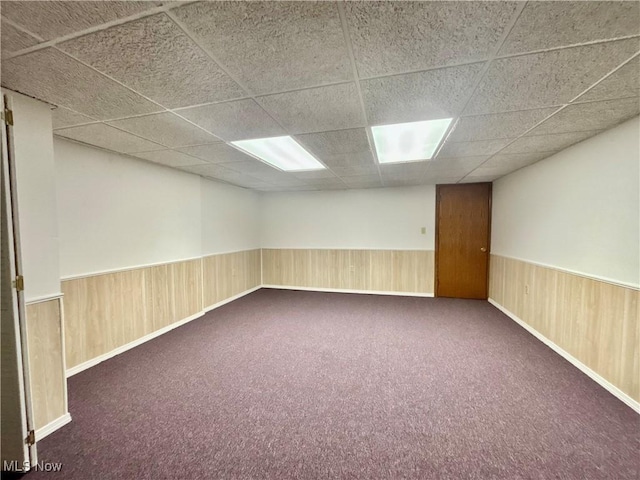 29123 Ridge Rd, Wickliffe, OH 44092 - unfurnished room with a paneled ceiling, wainscoting, carpet, and wooden walls