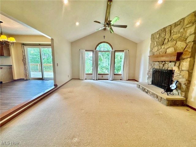 29123 Ridge Rd, Wickliffe, OH 44092 - unfurnished living room featuring a ceiling fan, carpet flooring, a fireplace, and lofted ceiling