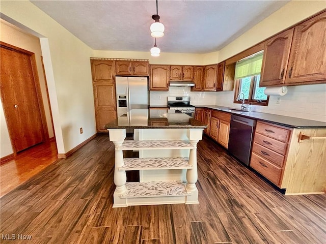 29123 Ridge Rd, Wickliffe, OH 44092 - kitchen with stainless steel appliances, dark wood finished floors, brown cabinetry, and decorative backsplash