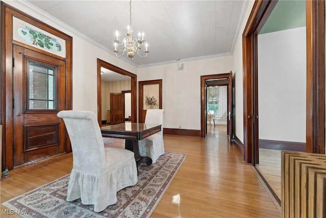 400 E Carrollton St, Magnolia, OH 44643 - dining space featuring a chandelier, ornamental molding, and light wood finished floors