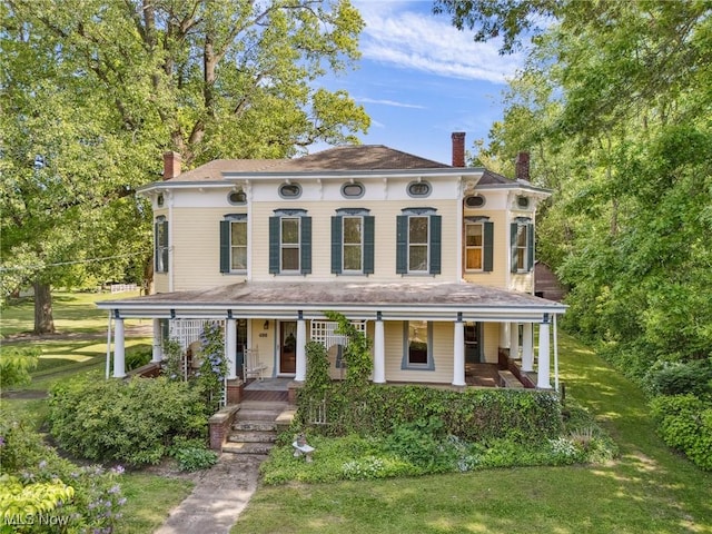 400 E Carrollton St, Magnolia, OH 44643 - italianate house with a chimney, a porch, and a front yard