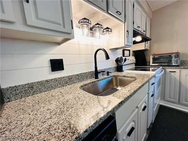 132 Dennis Dr, Cortland, OH 44410 - kitchen featuring under cabinet range hood, white electric stove, and light stone counters
