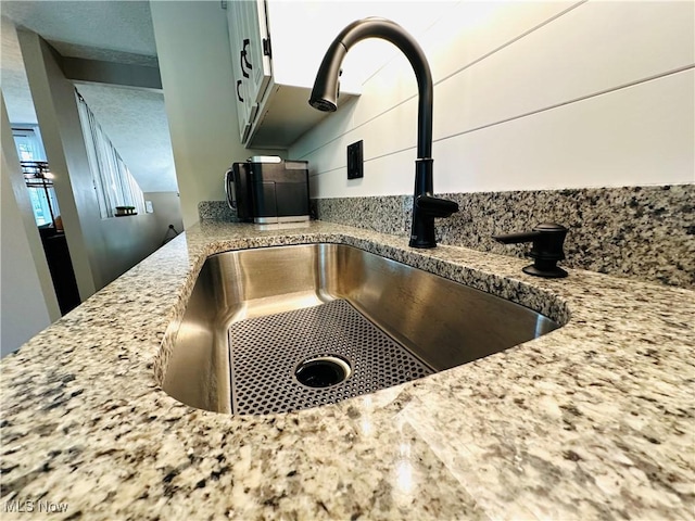 132 Dennis Dr, Cortland, OH 44410 - kitchen view of a sink and light stone countertops