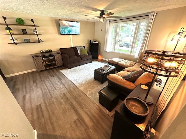 132 Dennis Dr, Cortland, OH 44410 - living room featuring a textured ceiling, wood finished floors, and a ceiling fan