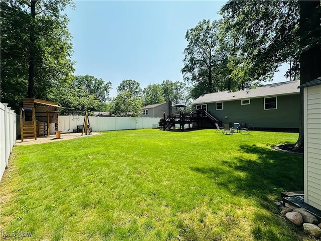 132 Dennis Dr, Cortland, OH 44410 - fenced backyard featuring stairs and a deck