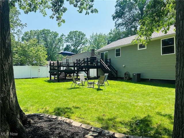132 Dennis Dr, Cortland, OH 44410 - view of yard featuring stairs, a wooden deck, an outdoor fire pit, and a gate