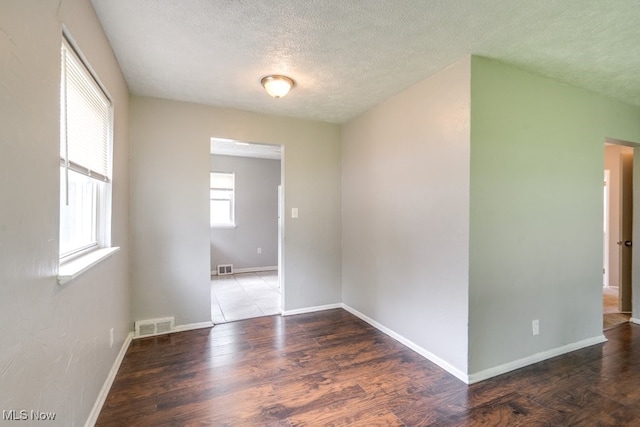 640 E 261st St, Euclid, OH 44132 - unfurnished room with a textured ceiling and wood finished floors
