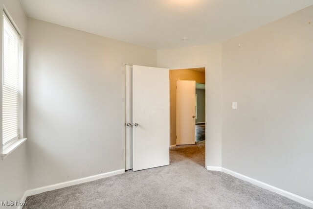 640 E 261st St, Euclid, OH 44132 - unfurnished bedroom with carpet flooring