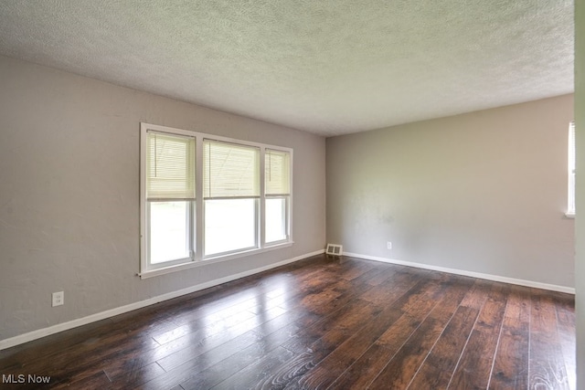 640 E 261st St, Euclid, OH 44132 - spare room with dark wood finished floors and a textured ceiling