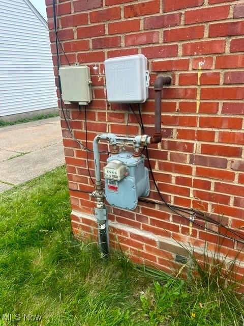 640 E 261st St, Euclid, OH 44132 - exterior view of brick siding and gas meter