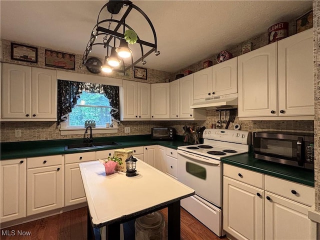 38474 Longs Crossing Rd, Leetonia, OH 44431 - kitchen with white range with electric stovetop, black microwave, under cabinet range hood, white cabinets, and dark wood-style flooring