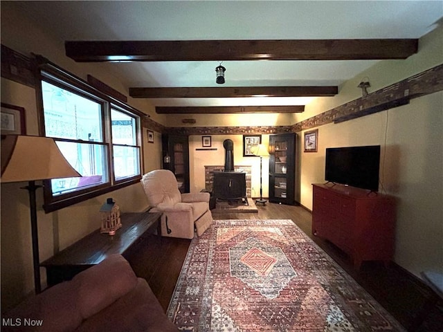 38474 Longs Crossing Rd, Leetonia, OH 44431 - living room with a wood stove, wood finished floors, and beam ceiling
