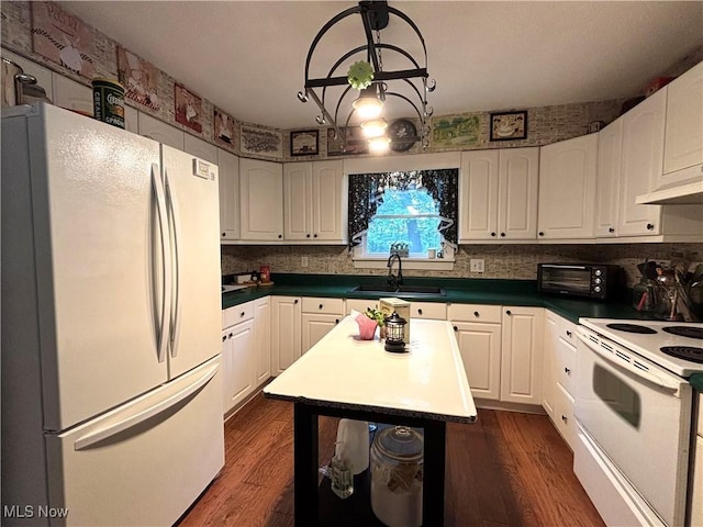 38474 Longs Crossing Rd, Leetonia, OH 44431 - kitchen with white appliances, decorative backsplash, white cabinetry, and dark wood-style floors