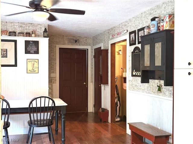 38474 Longs Crossing Rd, Leetonia, OH 44431 - dining room with ceiling fan, wallpapered walls, dark wood finished floors, a textured ceiling, and radiator heating unit
