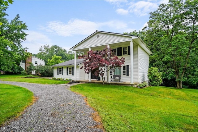 7436 Crory Rd, Canfield, OH 44406 - greek revival house featuring covered porch, gravel driveway, and a front yard