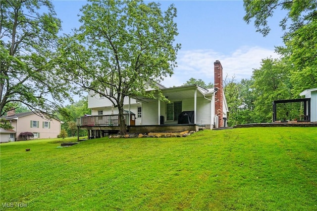 7436 Crory Rd, Canfield, OH 44406 - back of property with a lawn, a chimney, and a deck