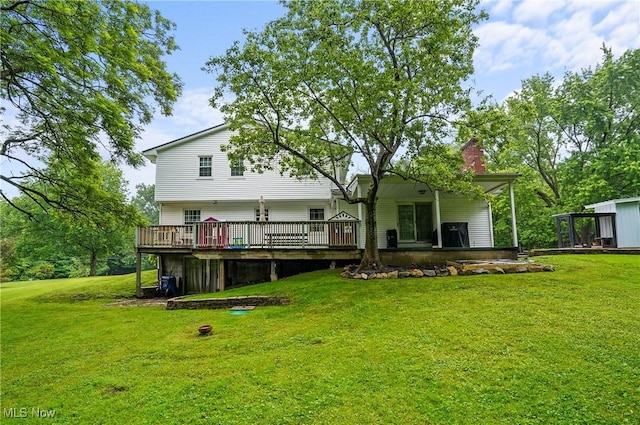7436 Crory Rd, Canfield, OH 44406 - rear view of house featuring a wooden deck, a lawn, and a chimney
