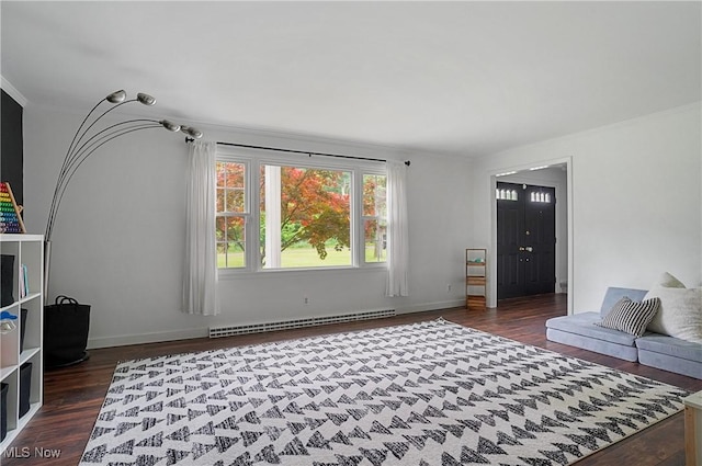 7436 Crory Rd, Canfield, OH 44406 - living room with baseboard heating, dark wood-type flooring, and ornamental molding
