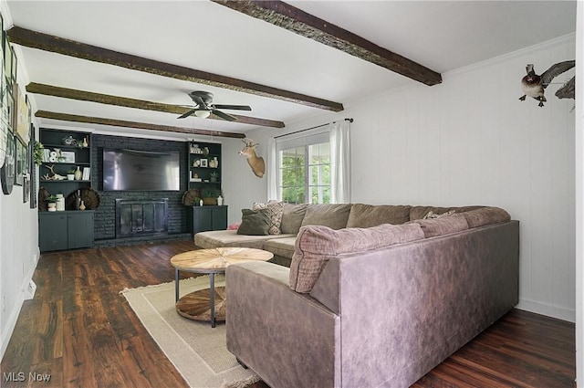 7436 Crory Rd, Canfield, OH 44406 - living room with wood finished floors, a ceiling fan, beam ceiling, and a brick fireplace
