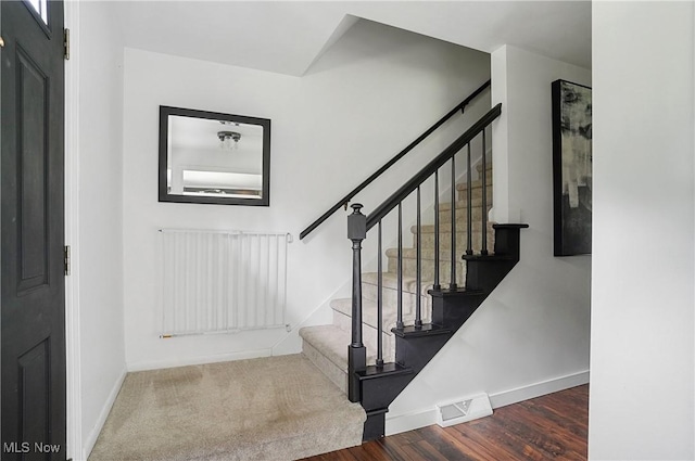 7436 Crory Rd, Canfield, OH 44406 - foyer with stairway, wood finished floors, and radiator heating unit