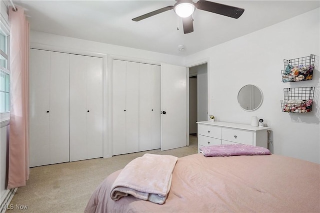 7436 Crory Rd, Canfield, OH 44406 - bedroom with multiple closets, light carpet, and a ceiling fan