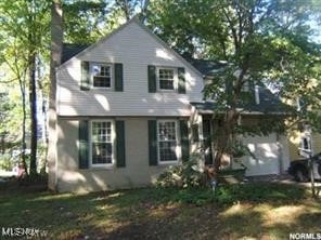 19807 Wickfield Ave, Warrensville Heights, OH 44122 - view of front of home with a chimney