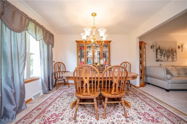 3661 Meander Reserve Cir, Canfield, OH 44406 - dining room featuring a chandelier and baseboards