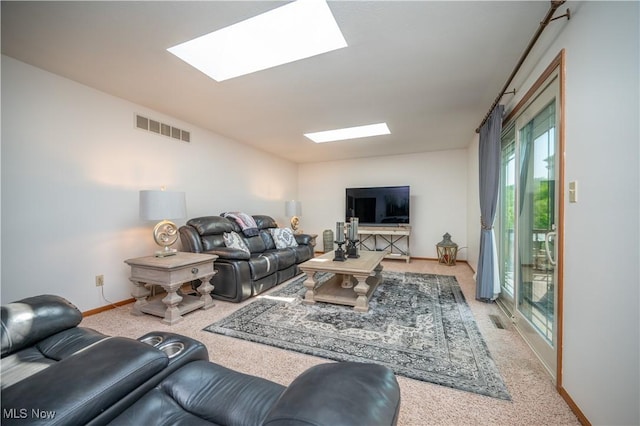 3661 Meander Reserve Cir, Canfield, OH 44406 - living area featuring a skylight, light colored carpet, and vaulted ceiling