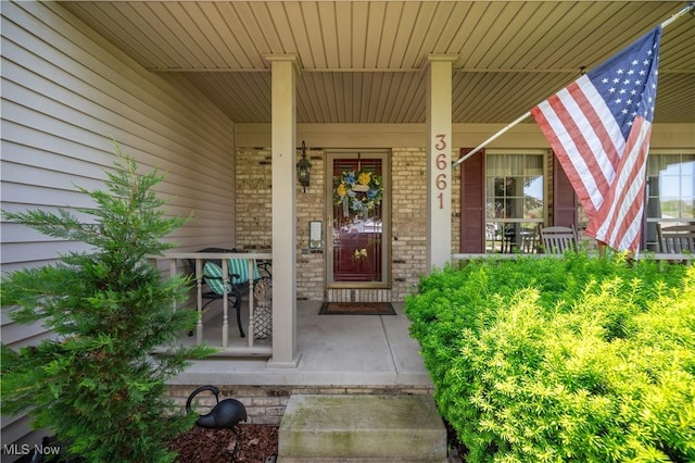 3661 Meander Reserve Cir, Canfield, OH 44406 - property entrance featuring a porch and brick siding
