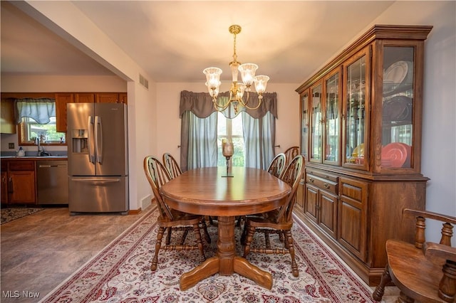 3661 Meander Reserve Cir, Canfield, OH 44406 - dining room featuring a chandelier and baseboards