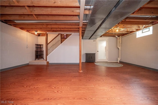 3661 Meander Reserve Cir, Canfield, OH 44406 - below grade area with wood finished floors, stairs, and concrete block wall