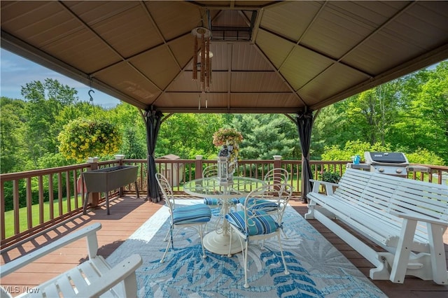 3661 Meander Reserve Cir, Canfield, OH 44406 - wooden terrace featuring a gazebo, outdoor dining area, a grill, and view of wooded area