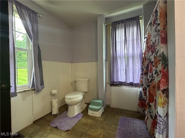 5130 Winfield St NE, East Canton, OH 44730 - bathroom with stone finish flooring and a shower with curtain
