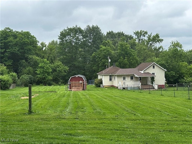 5130 Winfield St NE, East Canton, OH 44730 - view of yard featuring an outbuilding, a barn, a wooded view, and a wooden deck